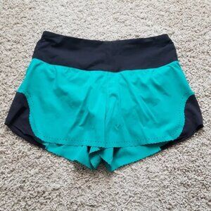 Lululemon athletica Smooth Stride Viridian Green & Black Shorts.